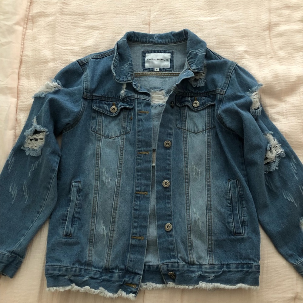 Distressed denim jacket